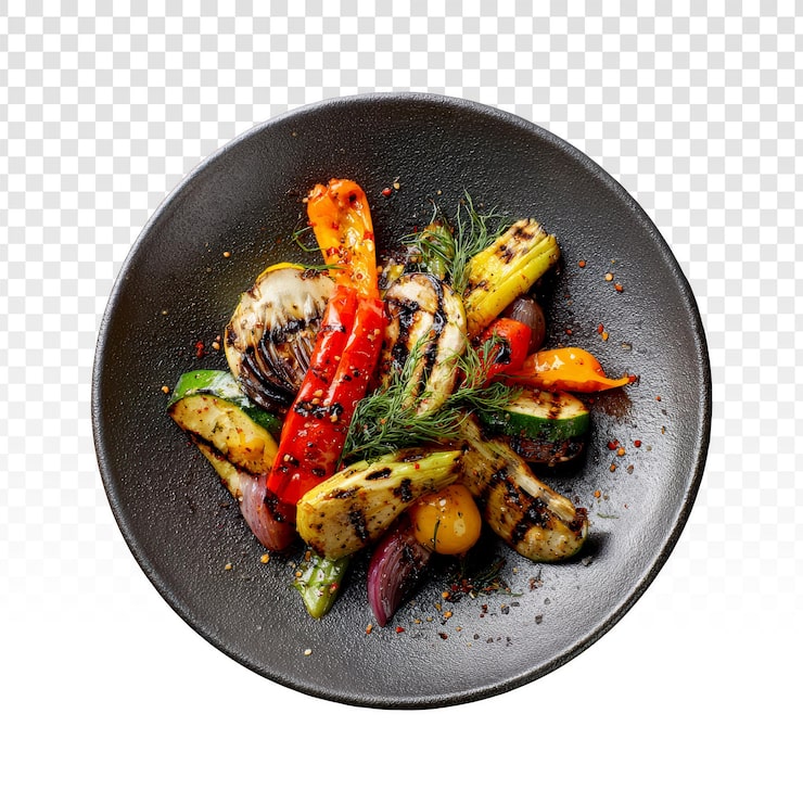 Assiette foncée de légumes braisés : fenouil grillé, poivrons, courgettes, aneth